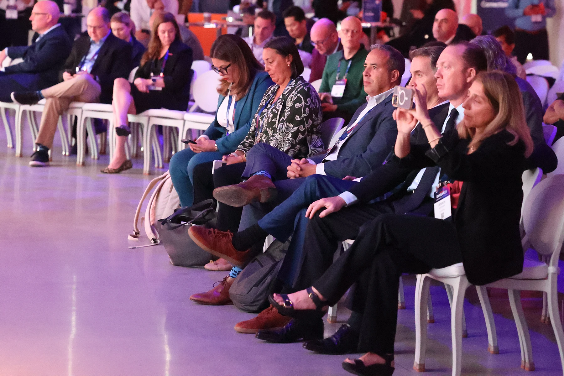 Attendees watching awards ceremony.